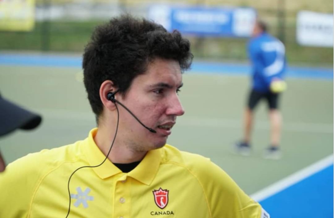Brandon working event operations on a pitch, headset on